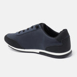 Dark blue comfort sneaker by bugatti with black trim and white accents on the sole, in side view.