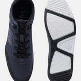Dark blue textured comfort sneakers by Bugatti with black laces and white patterned soles.