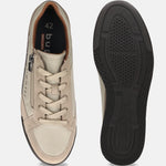 Beige bugatti Trevor comfort sneakers with laces and zipper, shown next to the shoe sole.