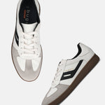 Pair of bugatti Carmelo sneakers in white, with suede and black accents, and brown soles.