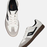 Pair of bugatti Carmelo sneakers in white, with suede and black accents, and brown soles.