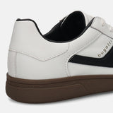 Cropped back view of a white bugatti sneaker with black accents and a dark brown sole.