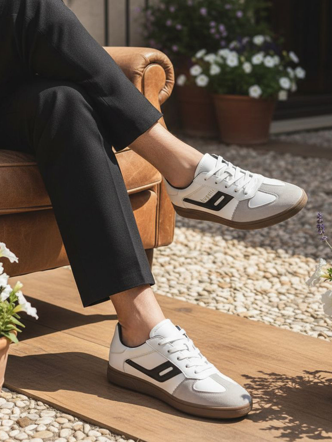 Lifestyle shot of bugatti Carmelo white sneakers, a modern, low-profile style with suede and white leather accents.
