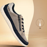Side view of a bugatti Bermudas taupe comfort sneaker featuring a side zipper and a navy trim.
