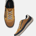 Pair of bugatti Bermudas yellow comfort sneakers; golden brown mesh with gray laces and navy accents.
