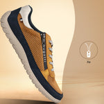 Side view of a bugatti Bermudas yellow Comfort sneaker, featuring a gold mesh upper, navy trim, and a side zipper.
