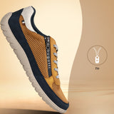 Side view of a bugatti Bermudas yellow Comfort sneaker, featuring a gold mesh upper, navy trim, and a side zipper.
