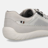 Close-up of a white bugatti sneaker showing mesh, textile, and suede-like material.