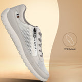 Side view of a white bugatti sneaker with a mesh upper, a zipper detail, and gray laces.
