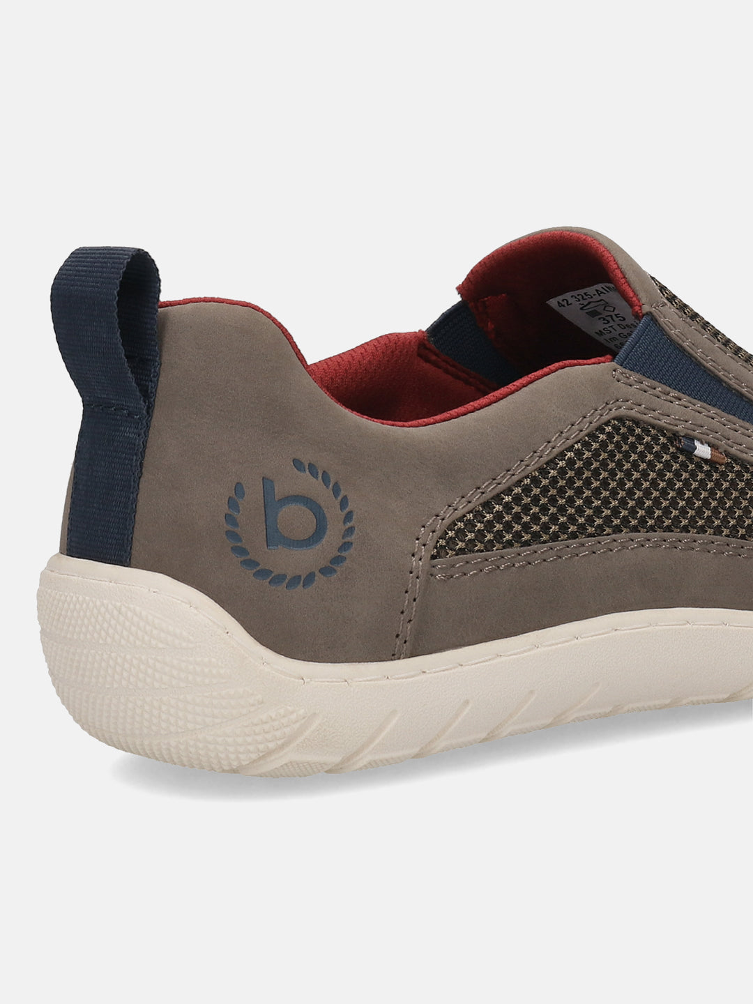 Cropped back view of a bugatti dark grey casual slip-on shoe with a textured white sole and navy pull tab.
