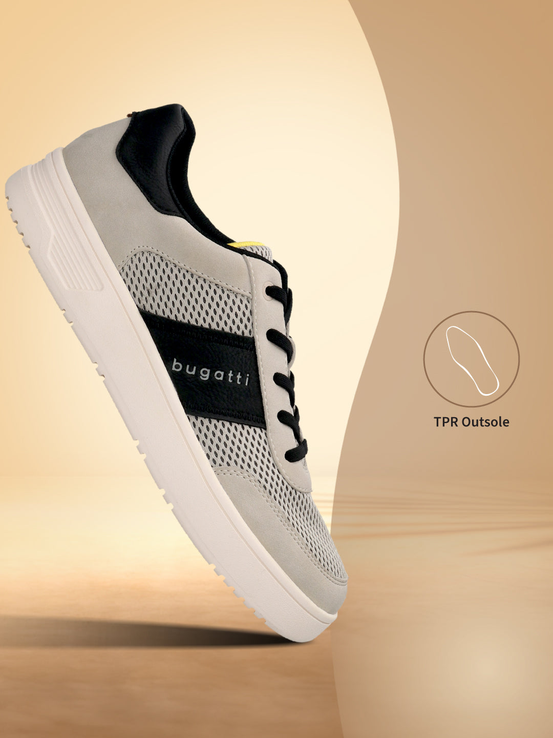 A bugatti Mackay light gray sneaker with a white sole and black accents, shown at a slight angle.
