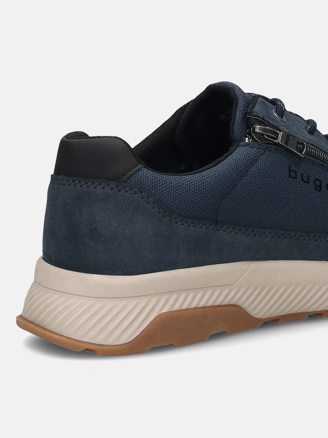 Back view of a dark blue bugatti Comfort Sneaker with a zipper detail, set on a textured tan and brown sole.

