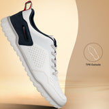 Side view of a white bugatti Samana sneaker with perforated leather, navy heel, gray laces, and a ridged sole.
