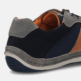 Grey leather comfort sneaker by bugatti, showing a stitched trim and navy textile panels.