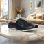 A blue Men's bugatti Mules featuring a round toe plain toe, zero heels heel. Made from premium genuine leather with a durable sebs (block copolymer) outsole, this slip-on design offers both style and comfort.