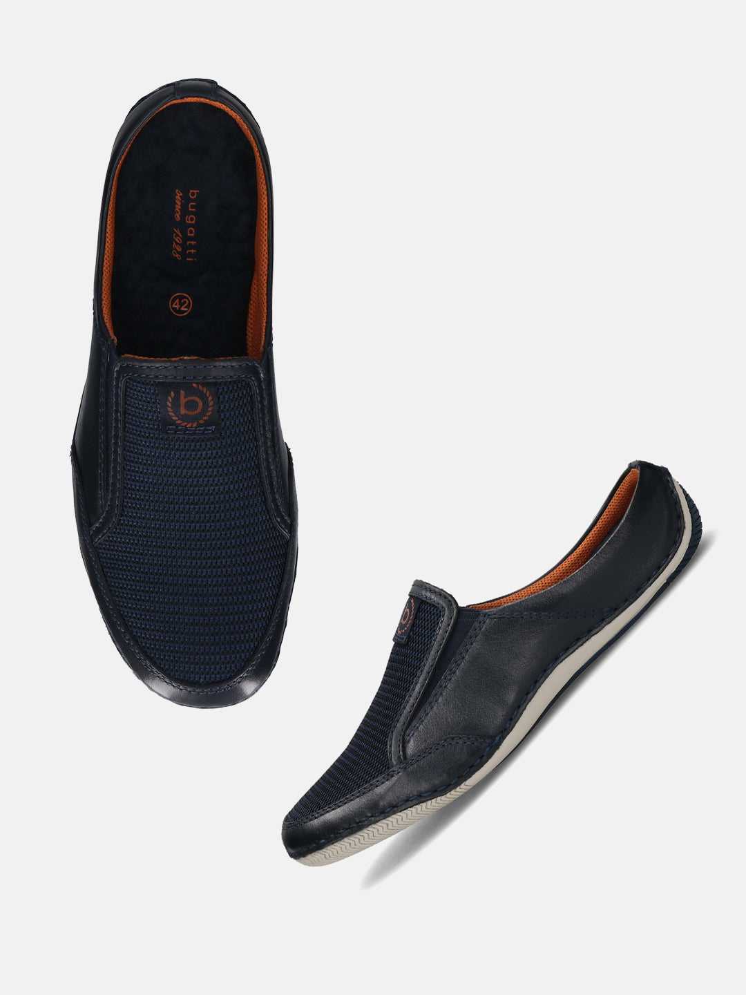 A blue Men's bugatti Mules featuring a round toe plain toe, zero heels heel. Made from premium genuine leather with a durable sebs (block copolymer) outsole, this slip-on design offers both style and comfort.