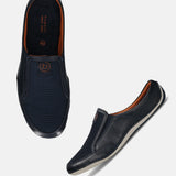 A blue Men's bugatti Mules featuring a round toe plain toe, zero heels heel. Made from premium genuine leather with a durable sebs (block copolymer) outsole, this slip-on design offers both style and comfort.
