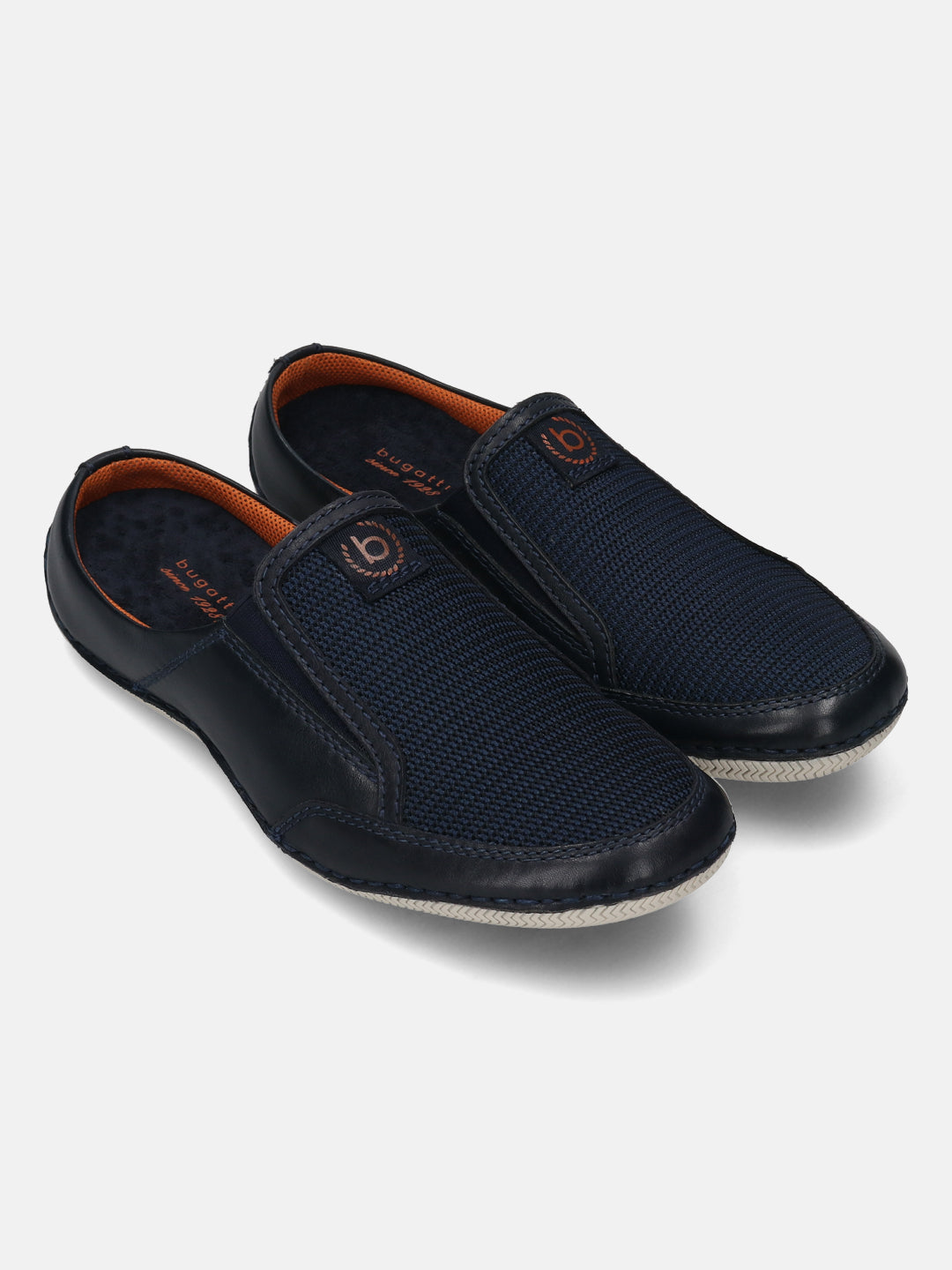 A blue Men's bugatti Mules featuring a round toe plain toe, zero heels heel. Made from premium genuine leather with a durable sebs (block copolymer) outsole, this slip-on design offers both style and comfort.