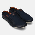 A blue Men's bugatti Mules featuring a round toe plain toe, zero heels heel. Made from premium genuine leather with a durable sebs (block copolymer) outsole, this slip-on design offers both style and comfort.