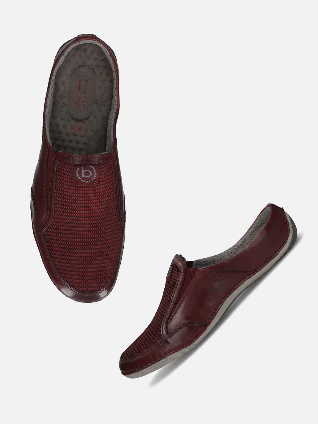 A grey Men's bugatti Mules featuring a round toe plain toe, zero heels heel. Made from premium genuine leather with a durable sebs (block copolymer) outsole, this slip-on design offers both style and comfort.