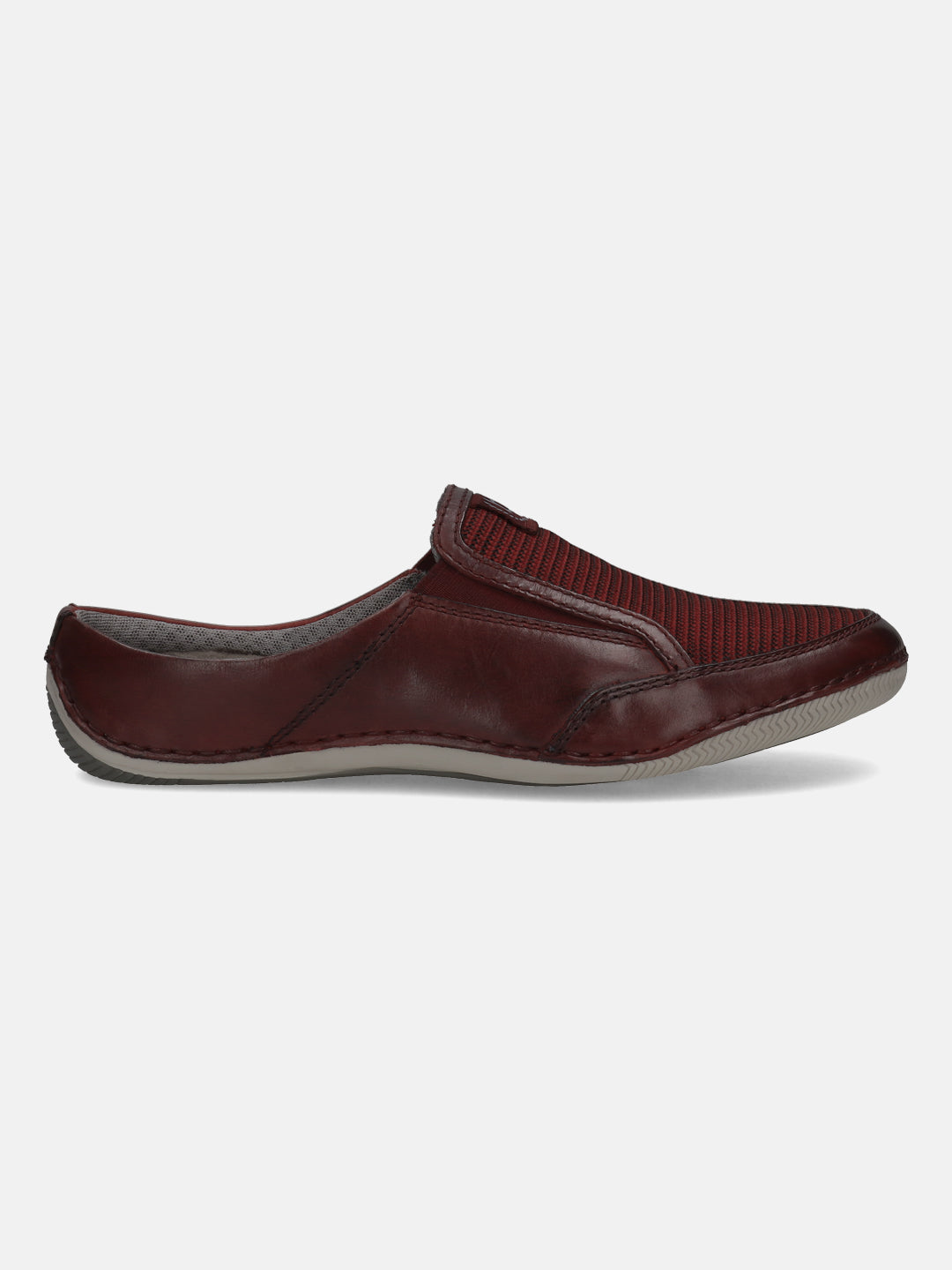 A grey Men's bugatti Mules featuring a round toe plain toe, zero heels heel. Made from premium genuine leather with a durable sebs (block copolymer) outsole, this slip-on design offers both style and comfort.