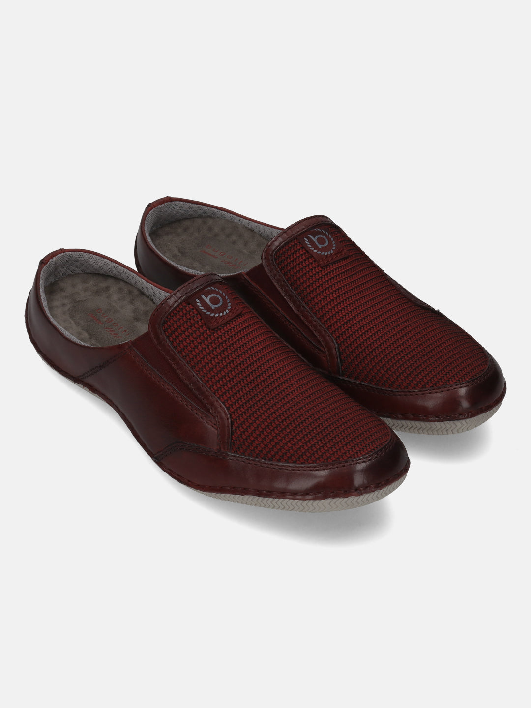 A grey Men's bugatti Mules featuring a round toe plain toe, zero heels heel. Made from premium genuine leather with a durable sebs (block copolymer) outsole, this slip-on design offers both style and comfort.