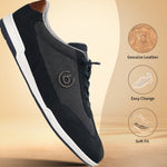 Dark blue leather sneakers by bugatti, with a white sole and tan heel accent.