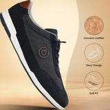 Dark blue leather sneakers by bugatti, with a white sole and tan heel accent.