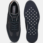 Dark blue leather sneakers by Bugatti, showing the sole and interior, with a textured pattern on the uppers.