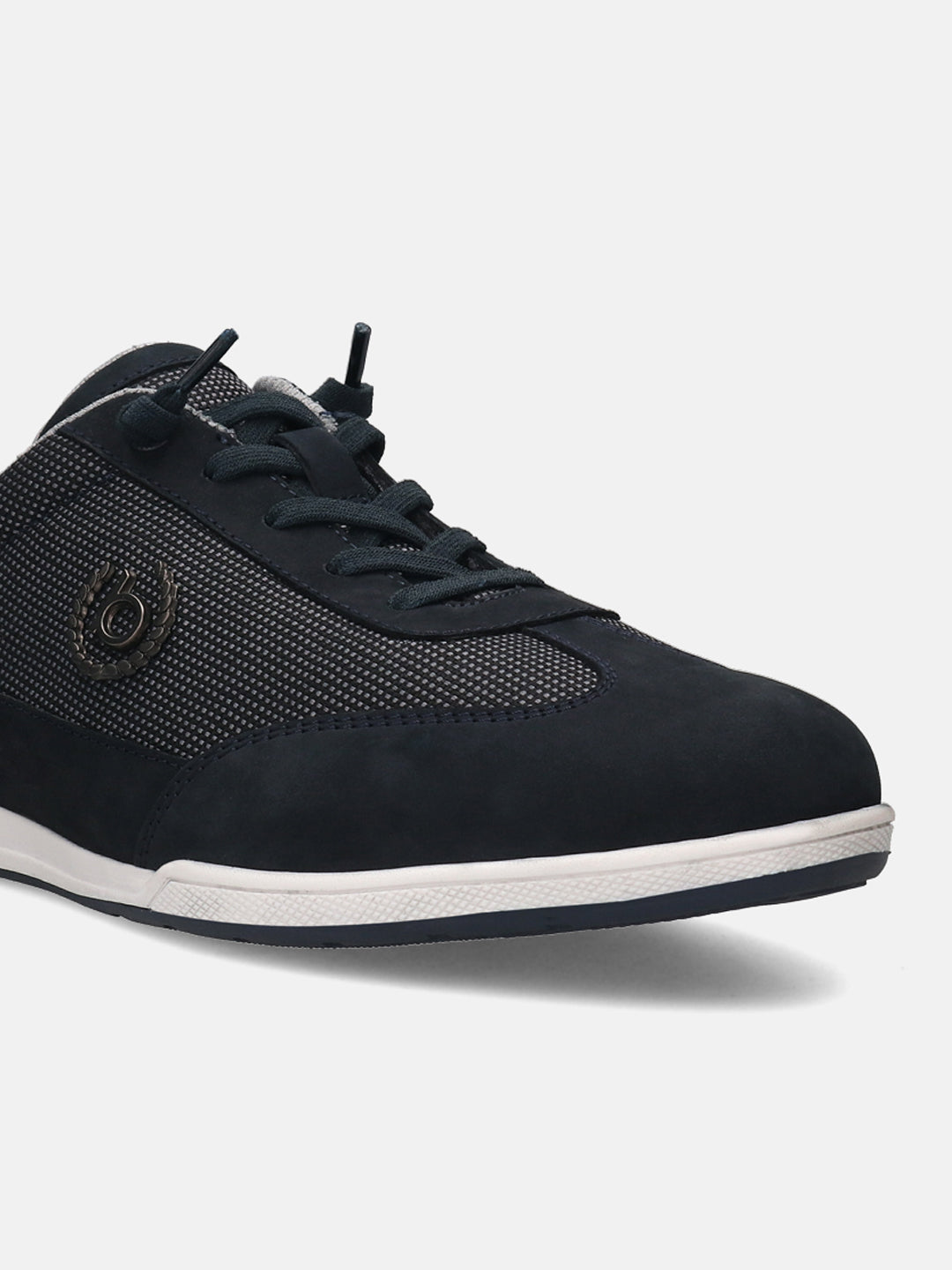 Dark blue leather sneaker by bugatti, showing a grid pattern and tonal laces.