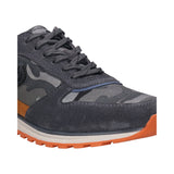 Cropped view of a bugatti Cirino gray sneaker with camo fabric, a suede toe, and an orange sole.
