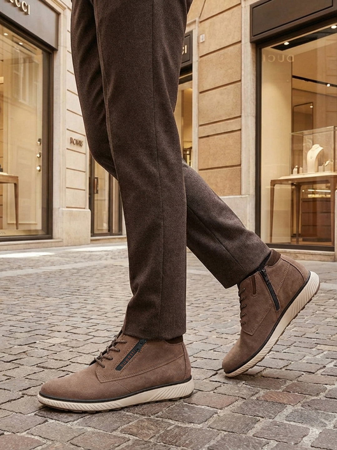 Lifestyle shot of bugatti Pramo Taupe premium leather comfort sneakers with zipper detail.
