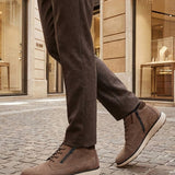 Lifestyle shot of bugatti Pramo Taupe premium leather comfort sneakers with zipper detail.
