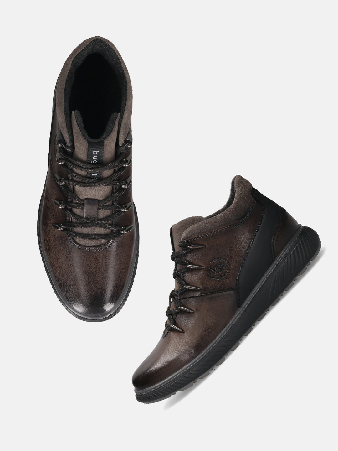 A grey Men's bugatti Sneakers featuring a round toe plain toe, zero heels heel, and a wide fit. Made from premium genuine leather with a durable tpr outsole, this zipper design offers both style and comfort.
