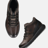 A grey Men's bugatti Sneakers featuring a round toe plain toe, zero heels heel, and a wide fit. Made from premium genuine leather with a durable tpr outsole, this zipper design offers both style and comfort.