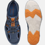 Blue comfort sneakers by bugatti, with orange and gray accents, showing a sole with a wavy pattern.
