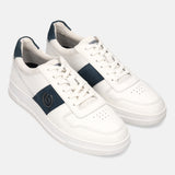 Off-white leather sneakers by bugatti with a navy stripe, white laces, and perforated toe.