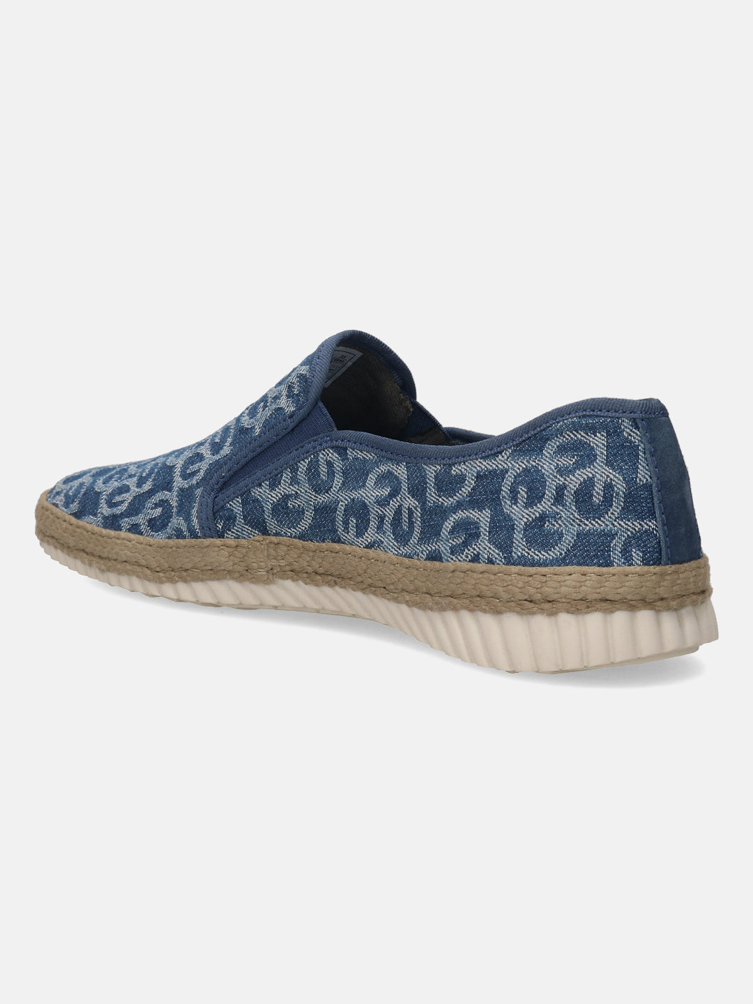 Blue denim slip-on shoe by Bugatti with a geometric pattern, jute midsole, and white ridged sole.
