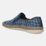 Blue denim slip-on shoe by Bugatti with a geometric pattern, jute midsole, and white ridged sole.