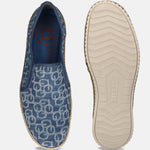 Blue canvas slip-on shoes by bugatti with a circular logo pattern and rope trim detailing.