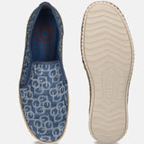 Blue canvas slip-on shoes by bugatti with a circular logo pattern and rope trim detailing.