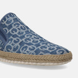 Blue slip-on shoe by bugatti, with a patterned denim upper and woven midsole.