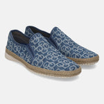 Blue denim comfort slip-ons by bugatti featuring an all-over geometric pattern, jute trim, and white soles.
