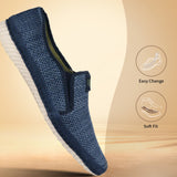 Blue slip-on casual shoe by bugatti with a textured upper and a white sole.