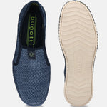 Blue textile slip-on shoe by bugatti with textured sole, shown with the sole facing up.
