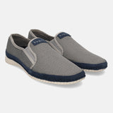 Light grey casual slip-ons by bugatti, featuring a woven texture and a navy blue accent trim.