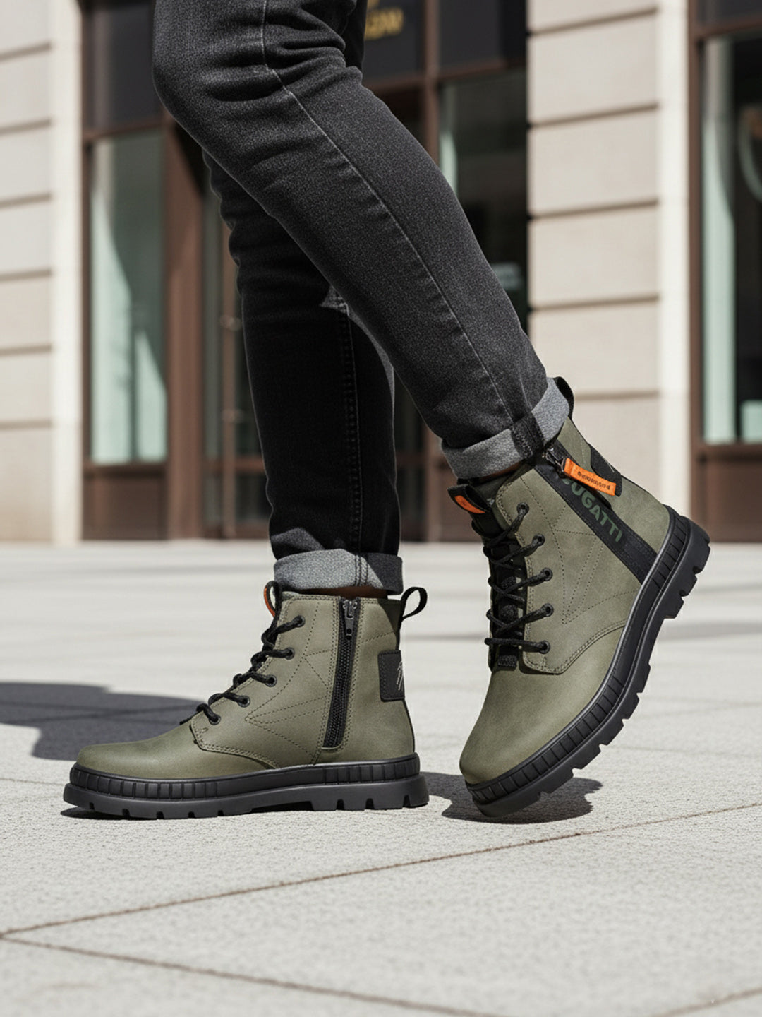 Lifestyle shot of bugatti Pallario comfort casual boots in dark green leather with black laces and soles.