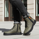 Lifestyle shot of bugatti Pallario comfort casual boots in dark green leather with black laces and soles.