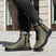 Lifestyle shot of bugatti Pallario comfort casual boots in dark green leather with black laces and soles.
