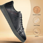 Black leather sneakers by bugatti with side zipper, decorative stitching, and textured rubber sole.
